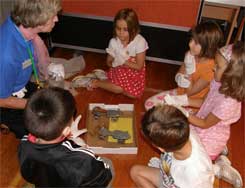 A Strong staffer introduces first graders to 50s-style roller skates