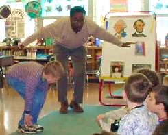 Arthur Brown works with a CR second-grader